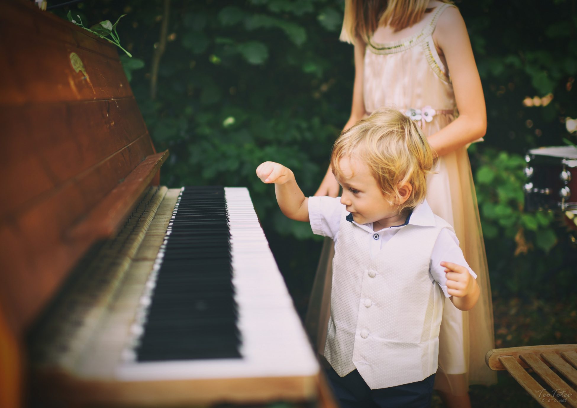 Child playing piano with one finger