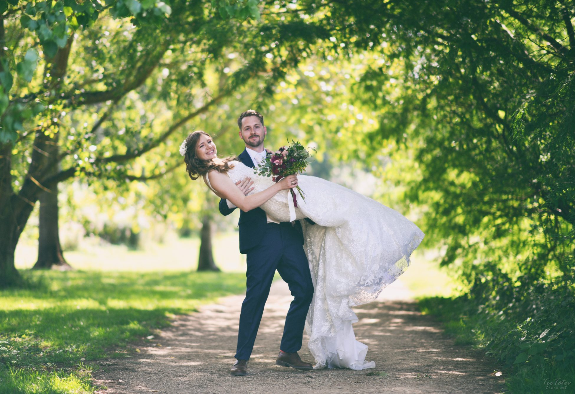 Groom carrying bride