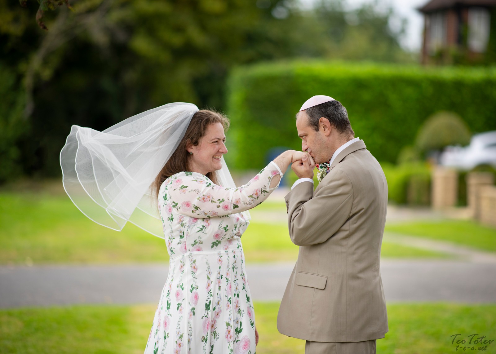 Groom kiss bride hand