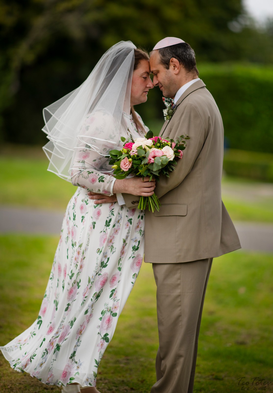 Newlyweds touching heads