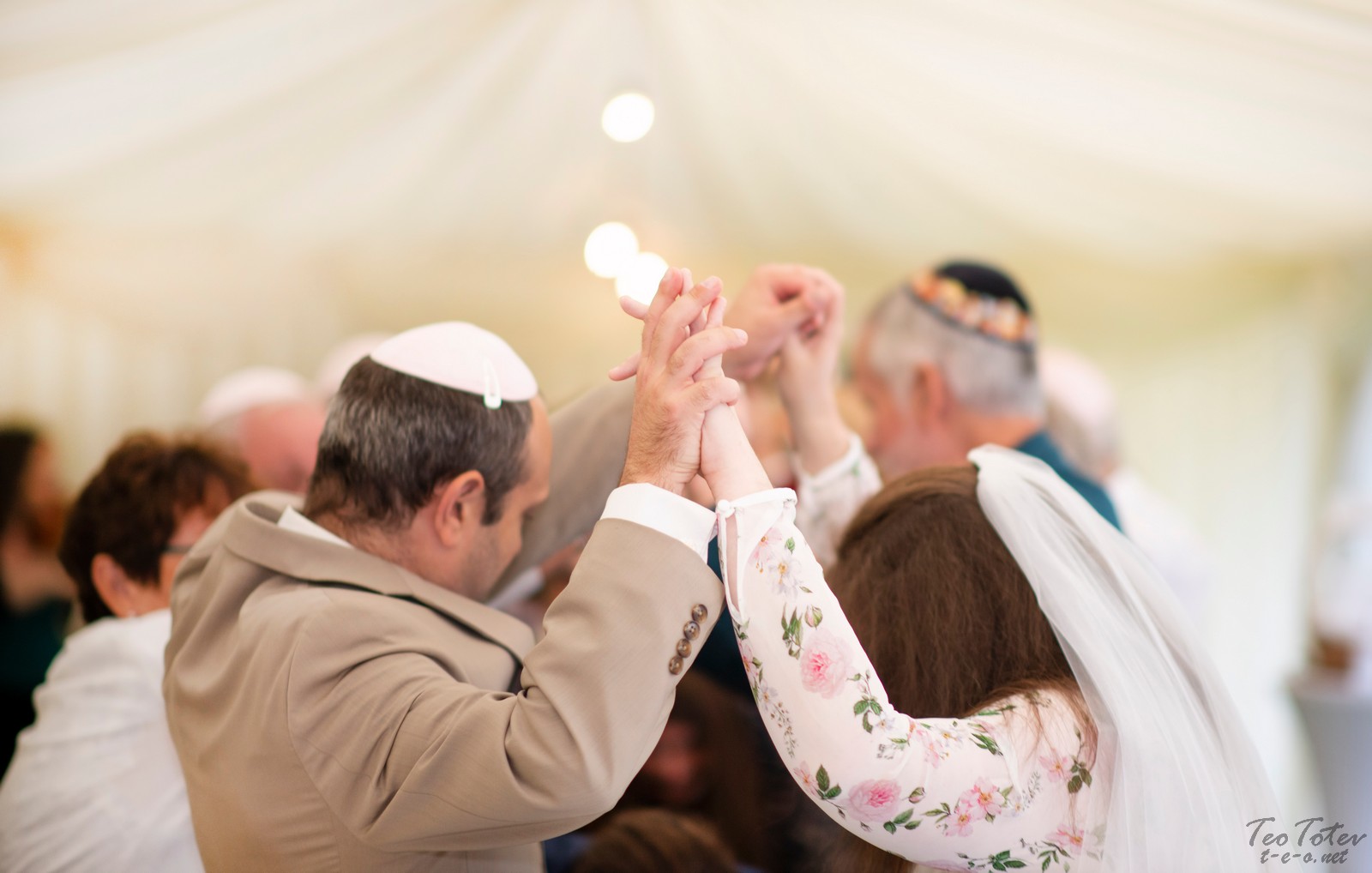 Tunnel of hands at jewish wedding